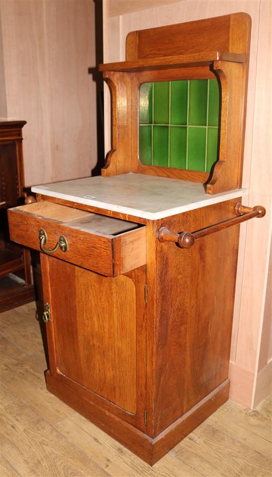 An Edwardian oak tile back washstand, W.70cms H.130cms